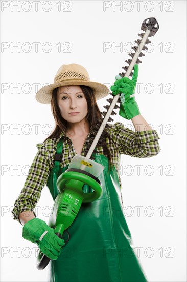 Female gardener holding a hedge trimmer