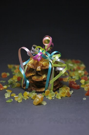 Candied orange peel and biscuits wrapped with a ribbon