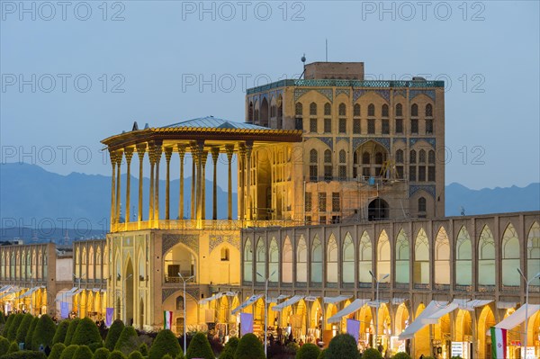 Illuminated Ali Qapu palace at dusk