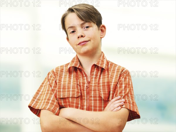 Boy with his arms crossed