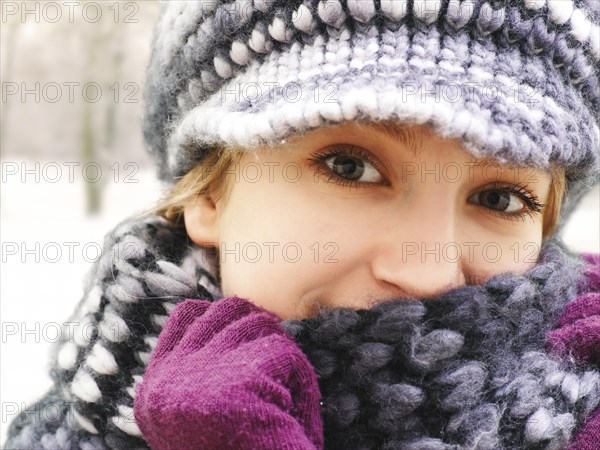 Girl wearing a hat and a scarf