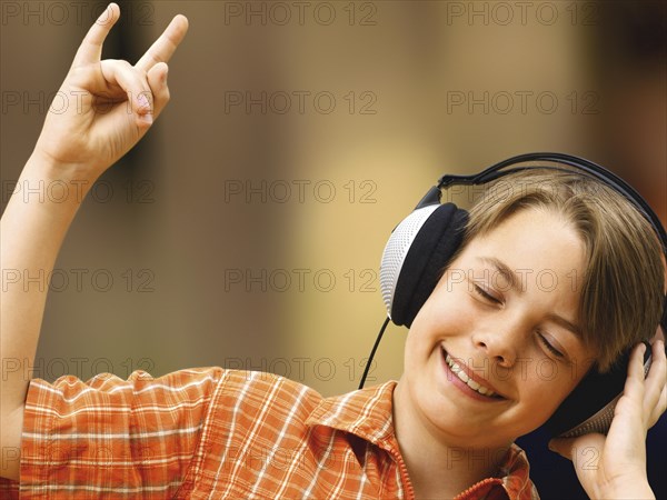 Boy listening to music with headphones