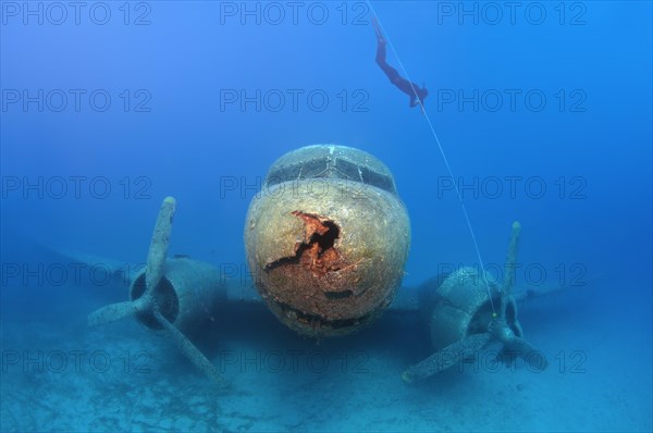 Freediver at plane wreck Douglas DC-3 'Dakota'