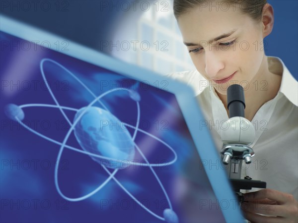 Scientist using a microscope