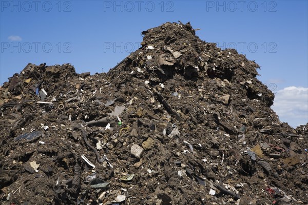 Pile of discarded automotive debris at a waste management site