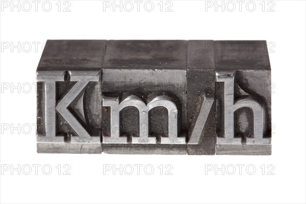 Old lead letters forming the acronym 'kmh' for kilometres per hour