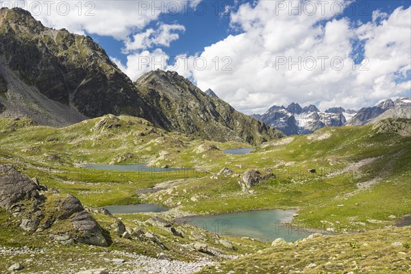 Macun plateau of lakes with views of the Verstancla group with the mountains Chaputschin and Verstanclahorn