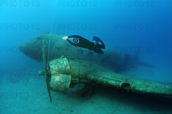 Freediver at plane wreck Douglas DC-3 'Dakota'