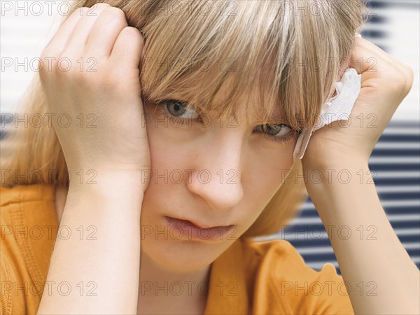 Young woman holding a tissue