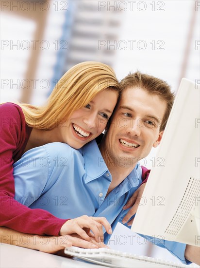 Young couple using a computer