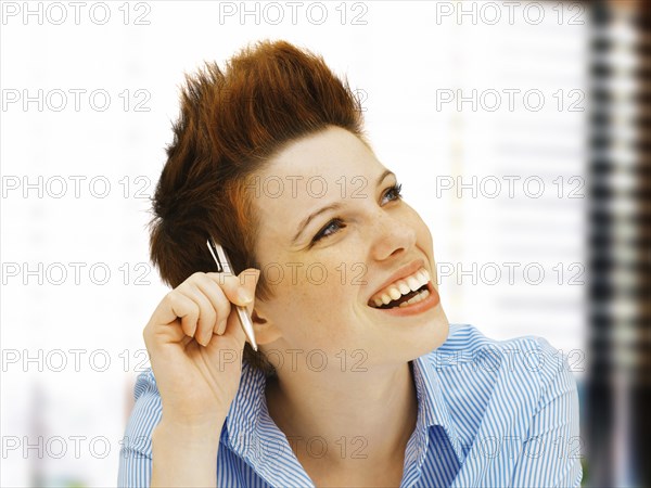 Businesswoman with a punk hairstyle in an office