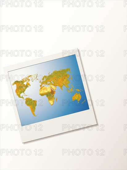 Polaroid with world map