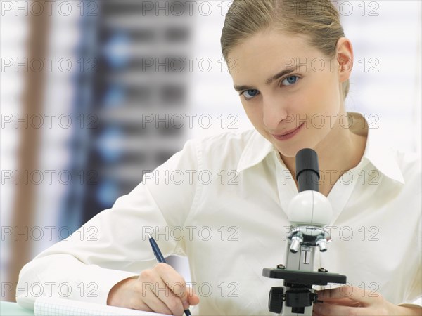 Scientist working with a microscope