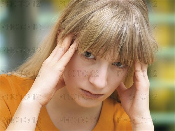 Young woman rubbing her temples