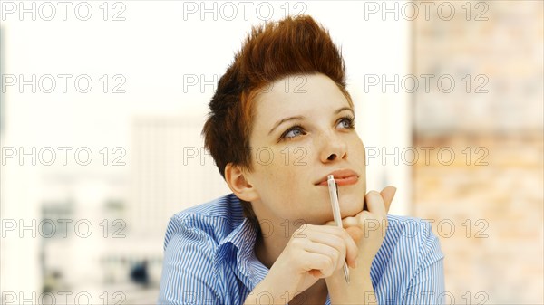 Businesswoman with a punk hairstyle in an office