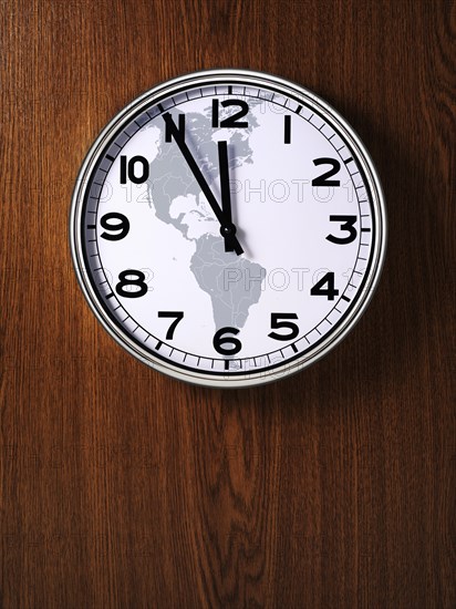 Clock with a map of North America and South America