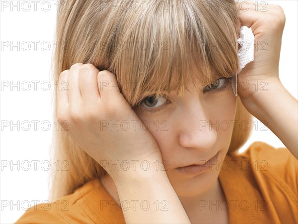 Young woman holding a tissue