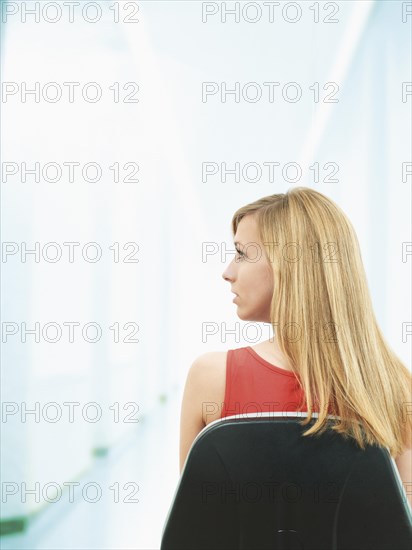 Young woman sitting on a chair