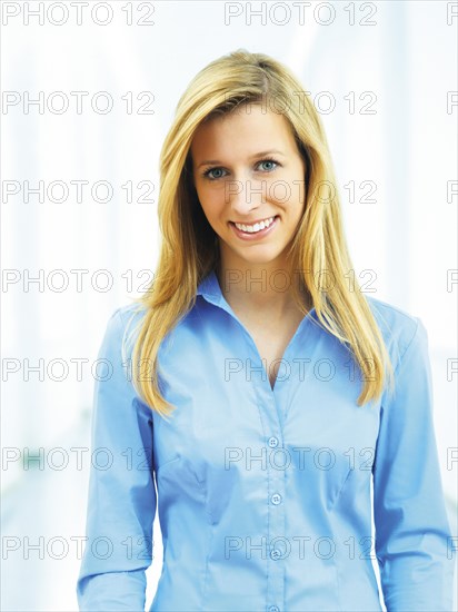 Young woman wearing a blue blouse