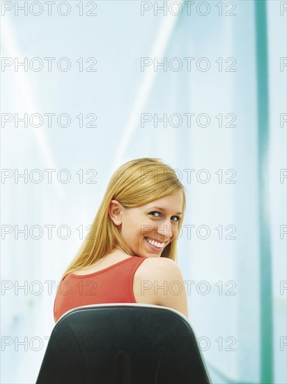 Young woman sitting on chair