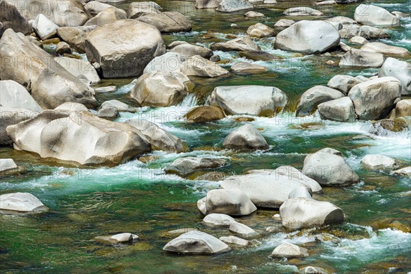 Stones in green clear water