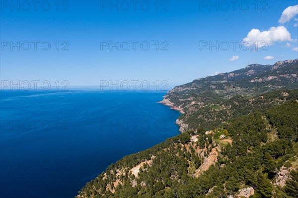 View of the cliffs with a remote house near Estellencs