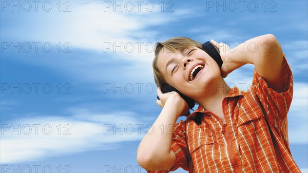 Boy listening to music with headphones