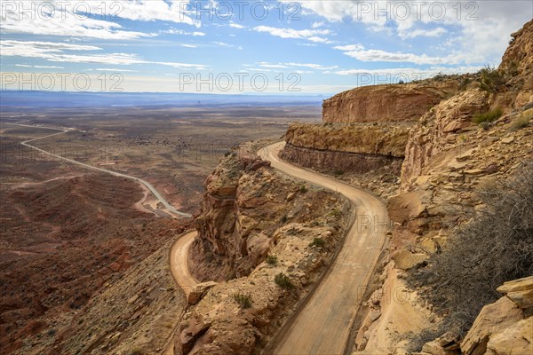 Moki Dugway leads in serpentines through the steep face of the Cedar Mesa