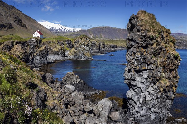 Lonely house at the basalt coast near the harbour