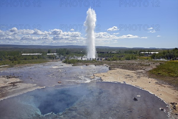 Hot water pool and erupting Strokkur Geysir