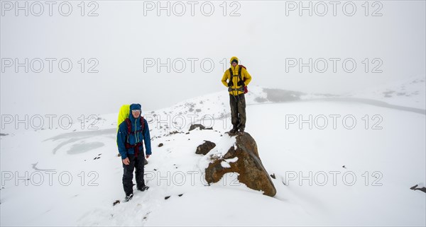 Hikers at Emerald Lake Lookout in Snow