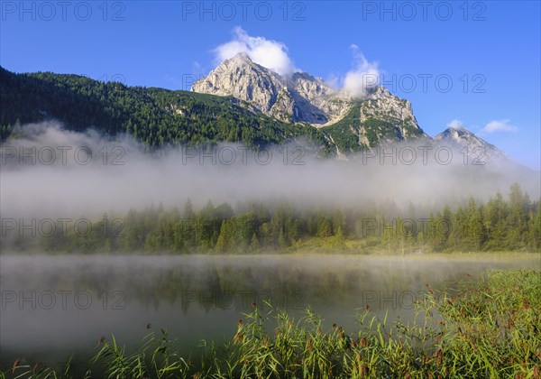 Wettersteinspitze and Lake Ferchensee with early fog