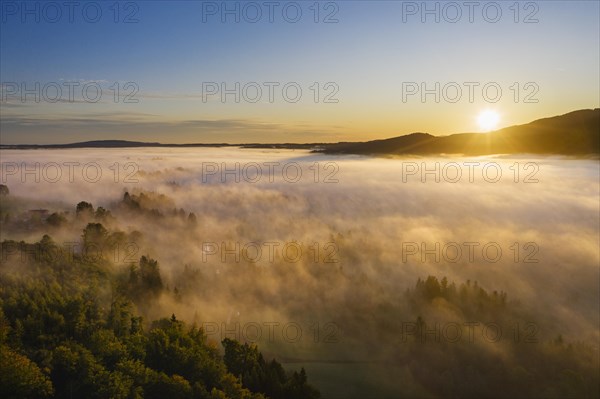 Sunrise with ground fog over Attenloher Filzen near Gaissach