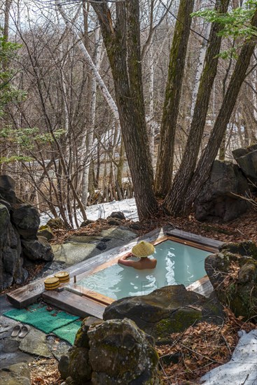 Woman bathing in an onsen