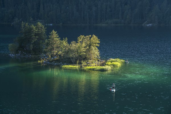 Island in Eibsee lake below the Zugspitze in the Wetterstein range in Grainau