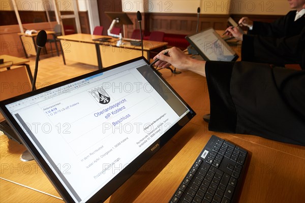 Judges train in the courtroom of the Higher Regional Court in Koblenz the electronic court file