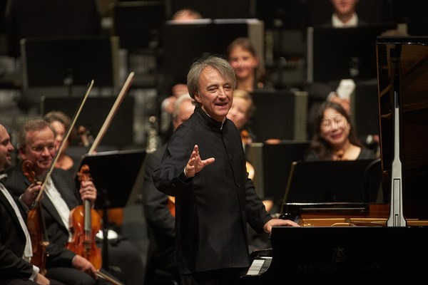 French pianist Jean-Efflam Bavouzet at a concert with the State Orchestra Rheinische Philharmonie