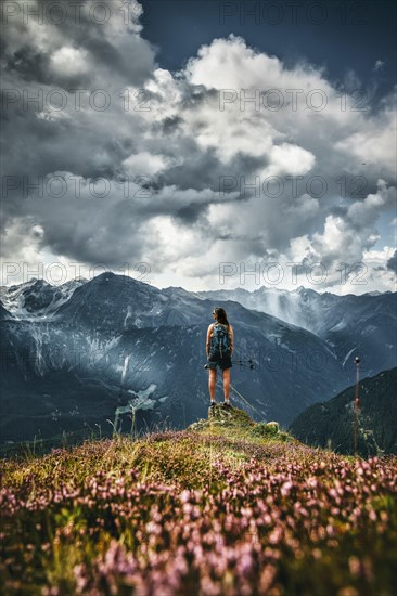 Woman in front of mountain range