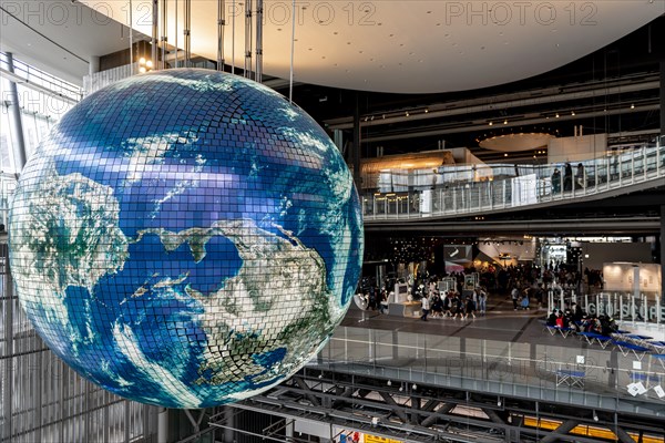 Big globe hangs from the ceiling