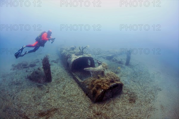 Wreck of a North American B25 bomber Mitchell from World War II with diver