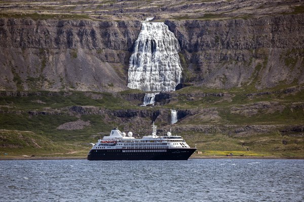 Cruise ship anchored in a fjord