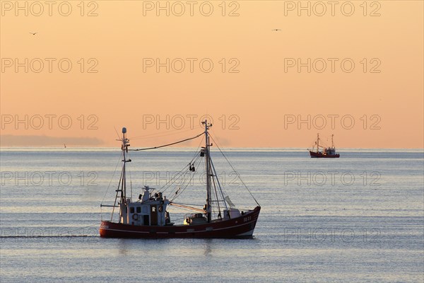 Fishing boat on fishing trip in the evening light