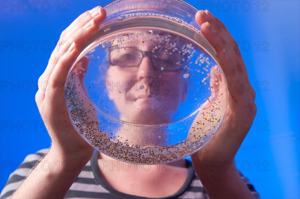 Woman conducting research in an aquaculture lab