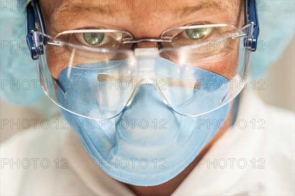 Scientist in necropsy lab wearing safety equipment