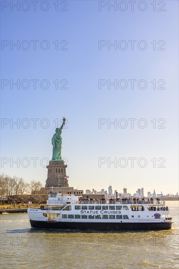 Statue of Liberty with passenger boat