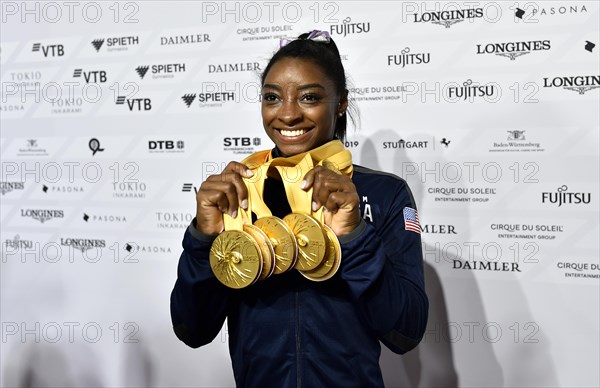 Simone Biles USA presents her 5 gold medals of the World Championships in Gymnastics