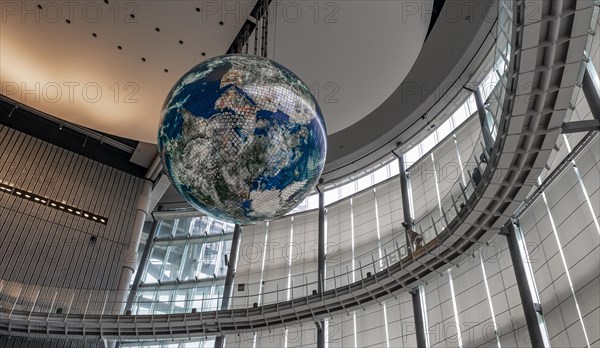 Big globe hangs from the ceiling