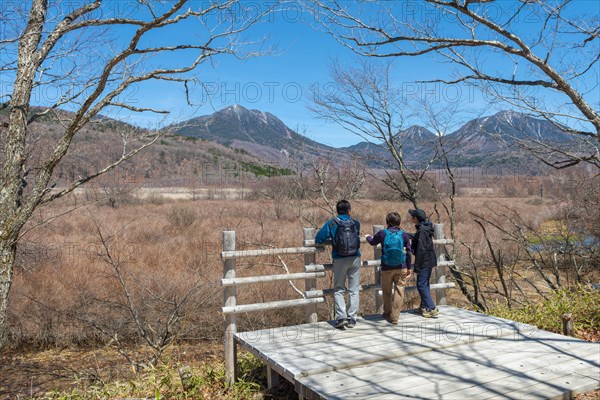 Japanese tourists look into nature