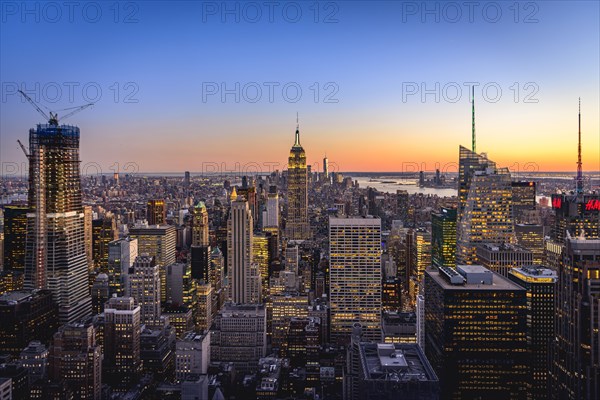 View of Midtown and Downtown Manhattan and Empire State Building from Top of the Rock Observation Center at sunset