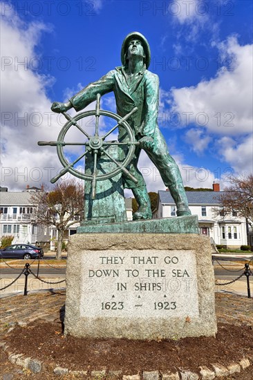 Bronze statue of a man at the wheel
